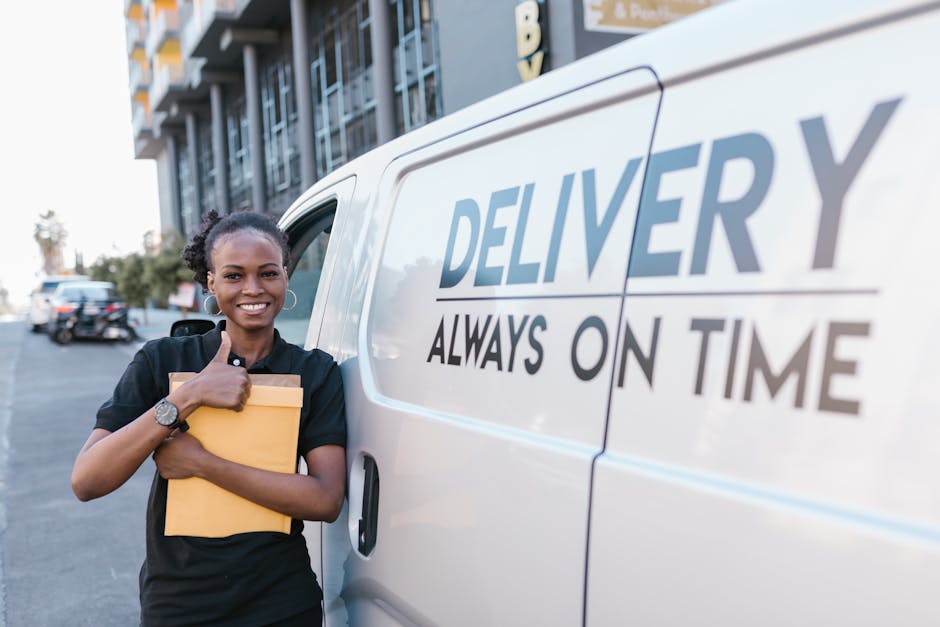 A smiling female flower delivery courier stands outdoors next to a white delivery van bearing the words 'DELIVERY ALWAYS ON TIME' in blue and black letters. She is holding a small, beige-colored box w
